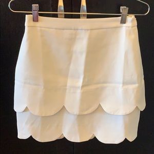 WHITE scalloped midi skirt.